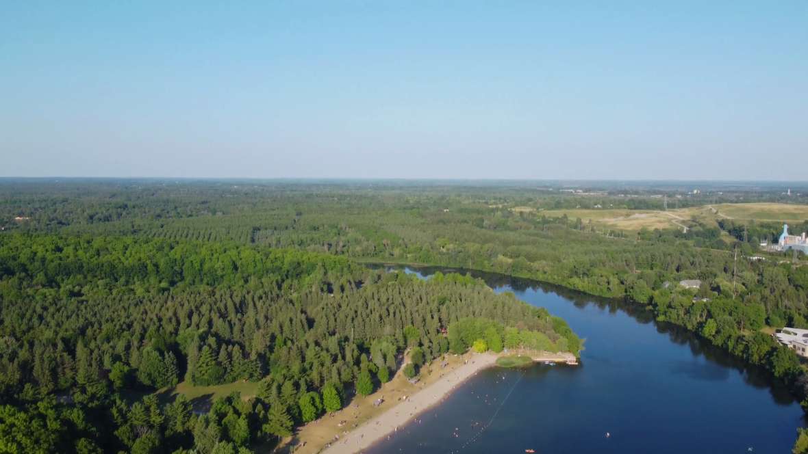 Rising above the trees to reveal the river